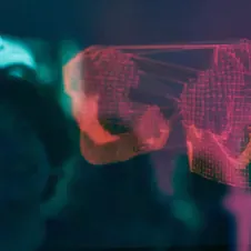 A digital hologram of a connected world with red wireframe graphics, symbolizing innovation and AI.